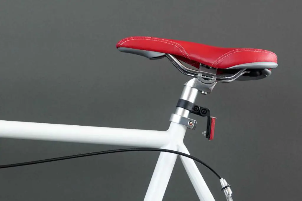 a red narrow bike saddle