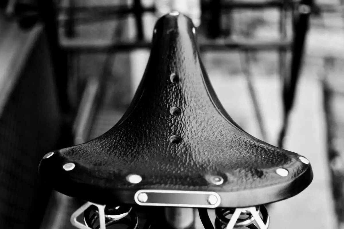 a wide saddle for a bike in black and white